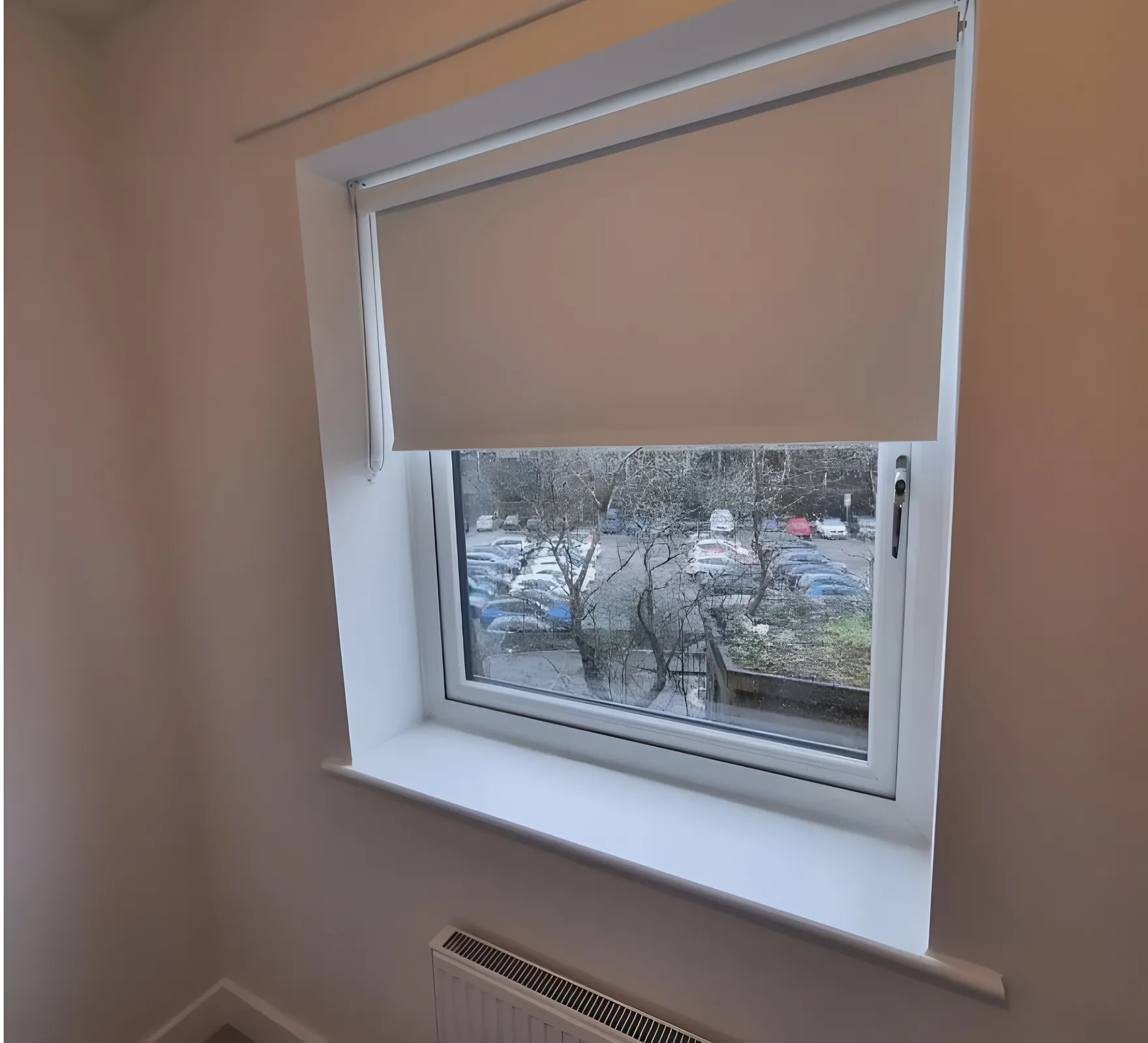 Blackout roller blind fitted inside the reveal of a bedroom window at Bark Street, Bolton