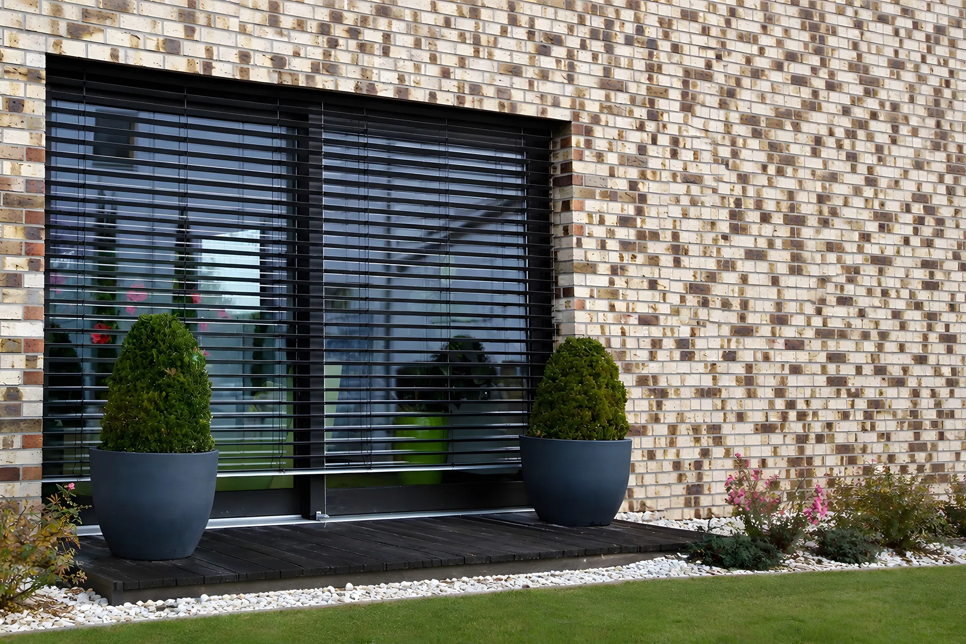 Black external Venetian blind fitted across a BizSpace office window