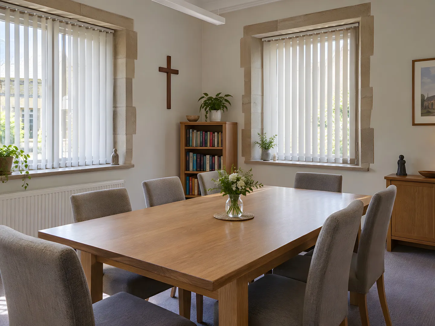 Linen-look vertical blinds beside a meeting table in a parish room