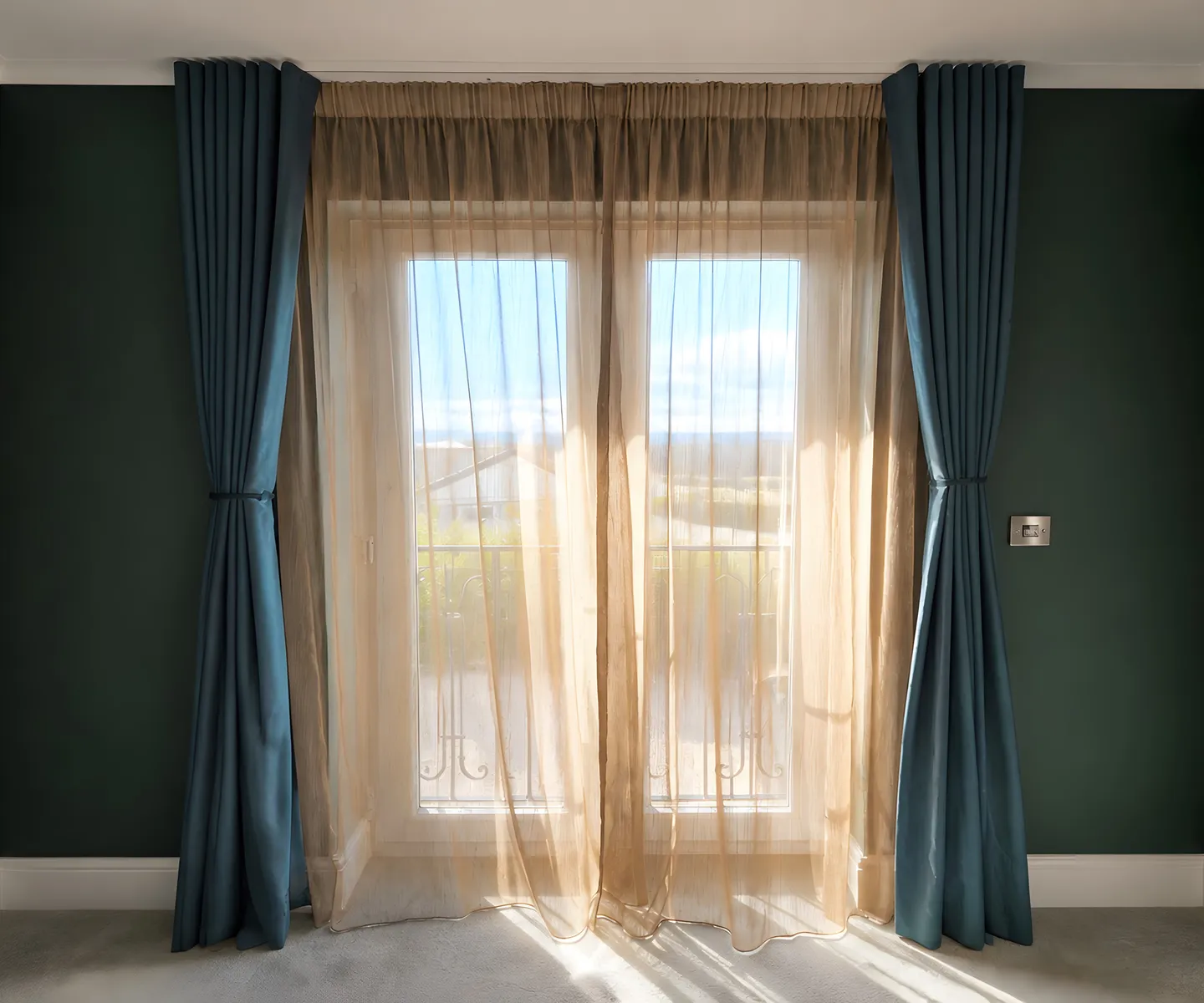 Full-length curtains and sheer fabric framing a British home window