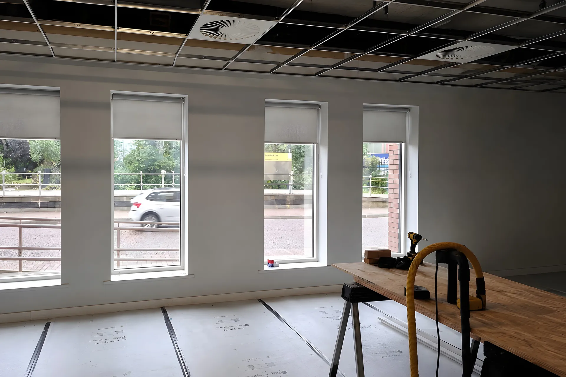 Pale grey roller blinds fitted during the DWP Salford office refurbishment