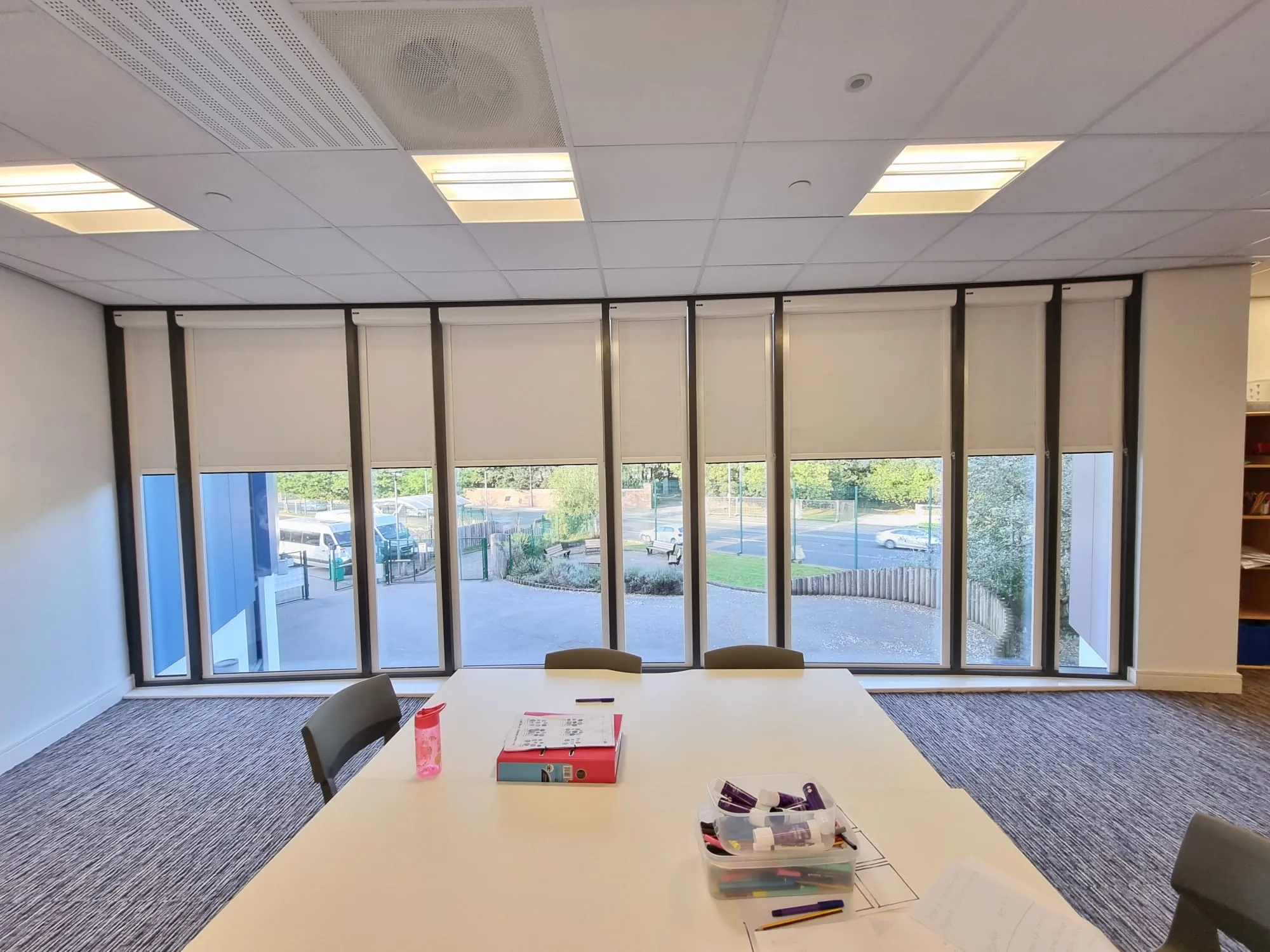White cassette roller blinds across a full window wall in the learning resource area at Elms Bank College Hub