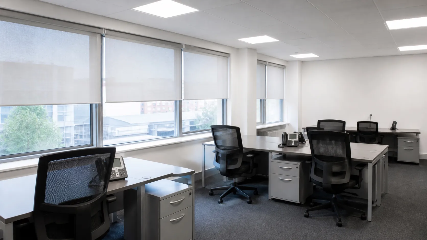 Finished roller blinds in a Miller House office