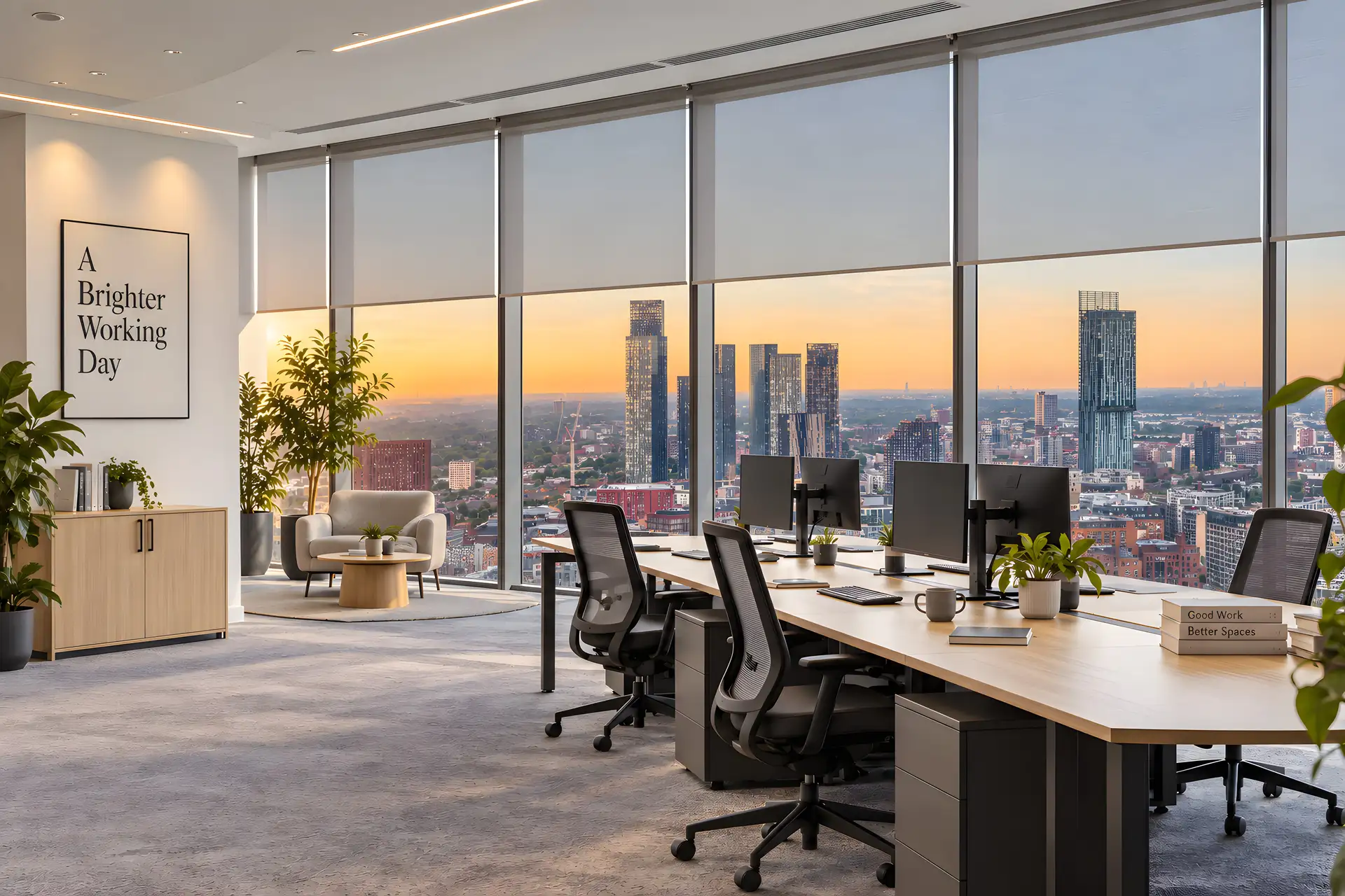 Illustrative office with screen roller blinds overlooking Manchester at sunset