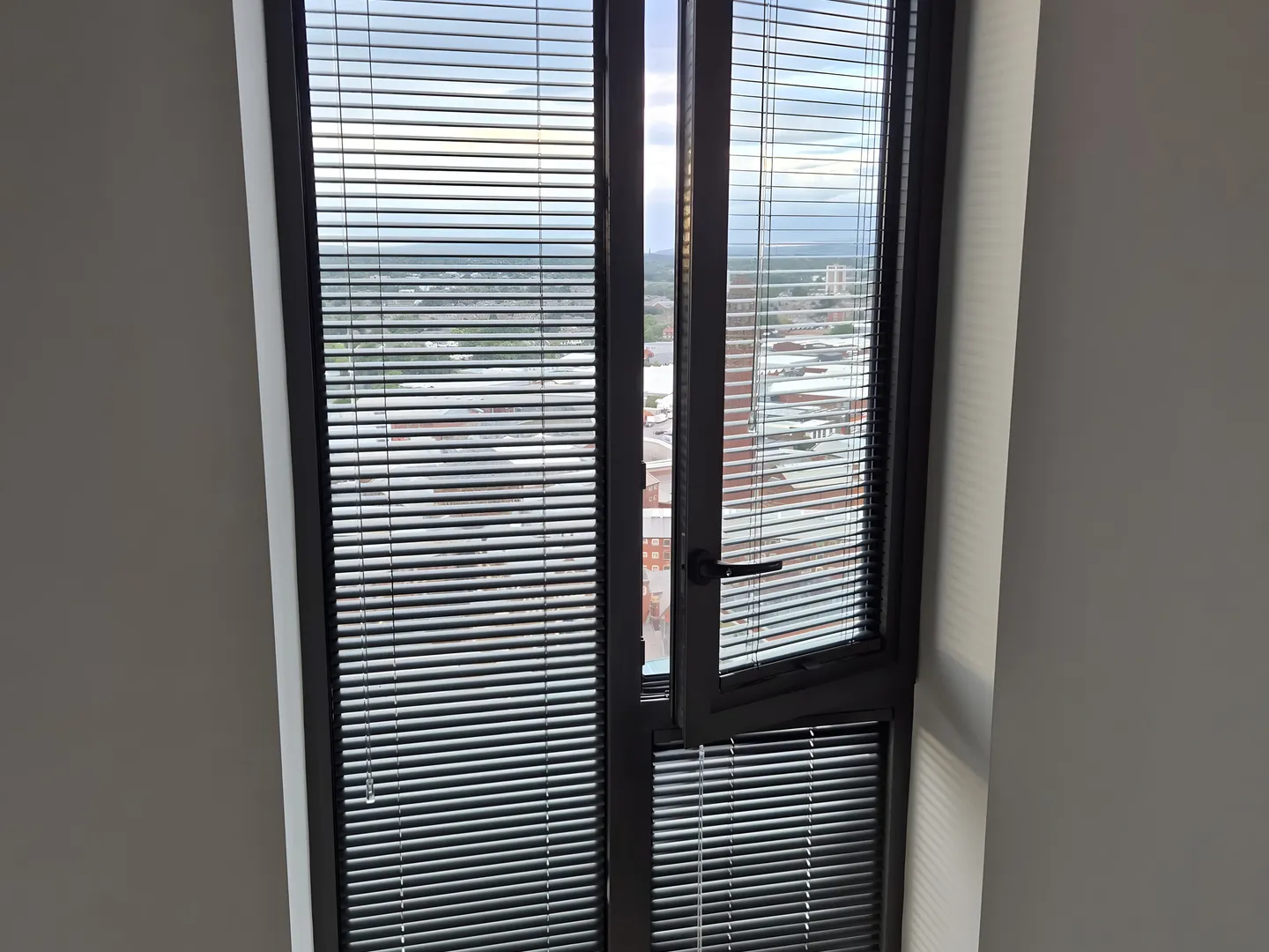 Perfect Fit blind staying on the frame as a tilt-and-turn window swings open