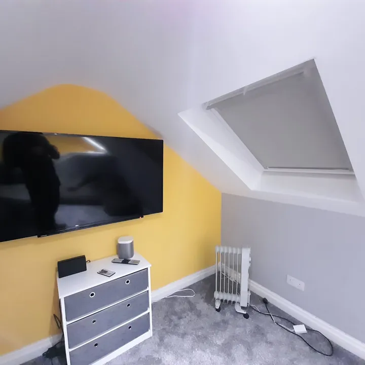 Blackout blind fitted to an angled roof window