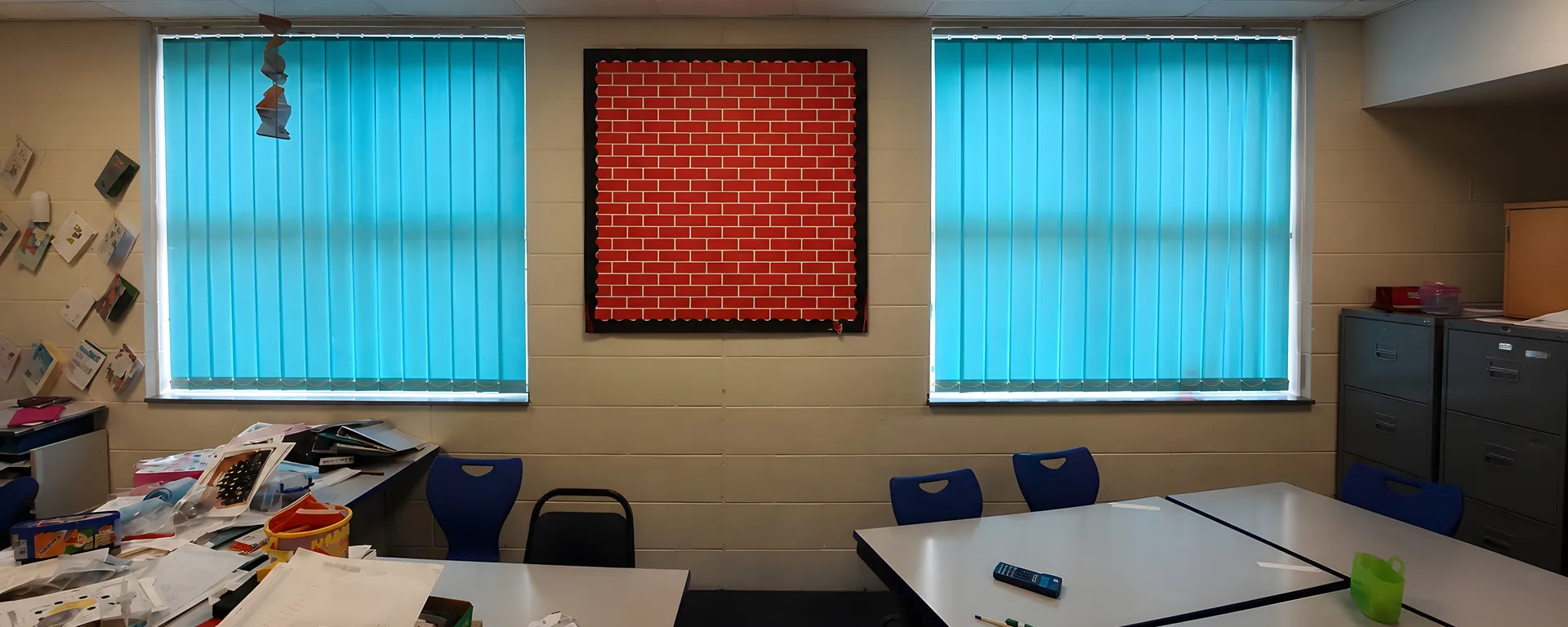 Turquoise vertical blinds fitted during SPIE Facilities school work
