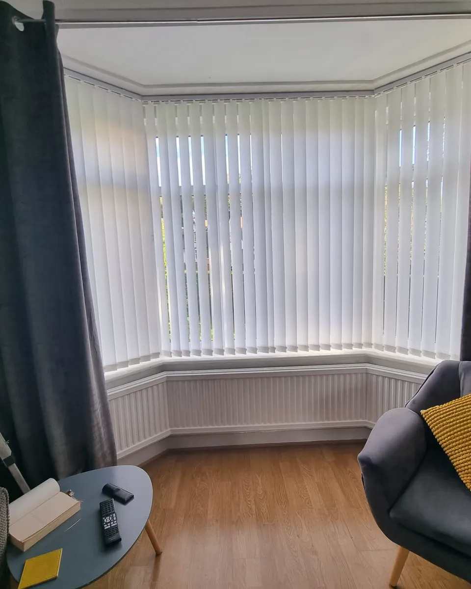 Close view of clean vertical blind fabric louvres